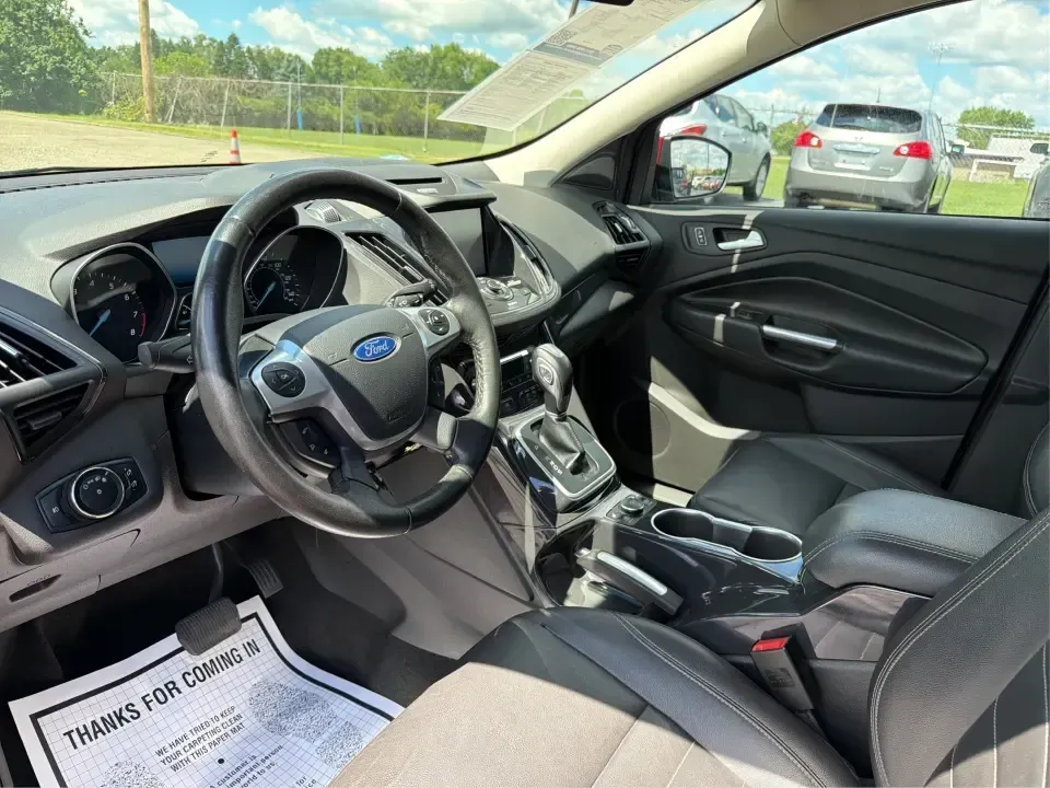2014 Ford Escape Titanium 4WD (1FMCU9J91EU) with an 2.0L L4 DOHC 16V engine, 6-Speed Automatic transmission, located at 1099 N County Rd 25A, Troy, OH, 45373, (937) 908-9800, 40.057079, -84.212883 - Weekend getaways to Hocking Hills, snowy commutes up I75, or the everyday school-and-grocery loop around Troy-this 2014 Ford Escape Titanium 4WD is built for the kind of life that doesn't slow down when the weather changes. With seating for five, flexible cargo space, and confident four-wheel drive,- Photo#9
