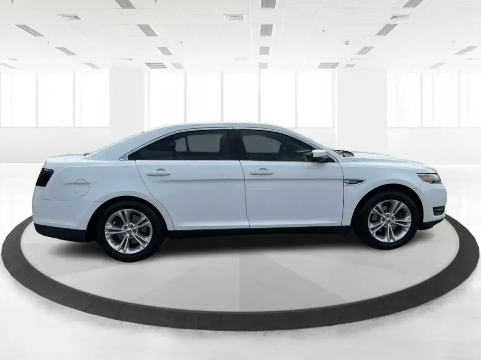 2015 Ford Taurus SEL FWD (1FAHP2E89FG) with an 3.5L V6 DOHC 24V engine, 6-Speed Automatic transmission, located at 1951 S Dayton Lakeview Rd., New Carlisle, OH, 45344, (937) 908-9800, 39.890999, -84.050255 - Need a comfortable, confident sedan for the daily commute, school drop-offs, and the occasional Dayton-to-Columbus road trip? This 2015 Ford Taurus SEL FWD is built for real life-roomy for five, smooth on longer drives, and packed with the kind of features that make every mile feel easier, whether y- Photo#1
