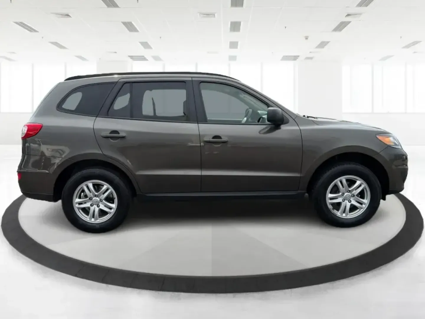 2012 Hyundai Santa Fe GLS 2.4 FWD (5XYZG3AB8CG) with an 2.4L L4 DOHC 16V engine, 6-Speed Automatic transmission, located at 8750 N County Rd 25A, Piqua, OH, 45356, (937) 908-9800, 40.164391, -84.232513 - Picture an easy weekend getaway: you load the cooler, fold the second-row seats for extra gear, and head out of Piqua toward Indian Lake or a day trip through the Miami Valley-without needing a giant SUV. This 2012 Hyundai Santa Fe GLS 2.4 is a practical, five-passenger SUV that fits real life, whet- Photo#1