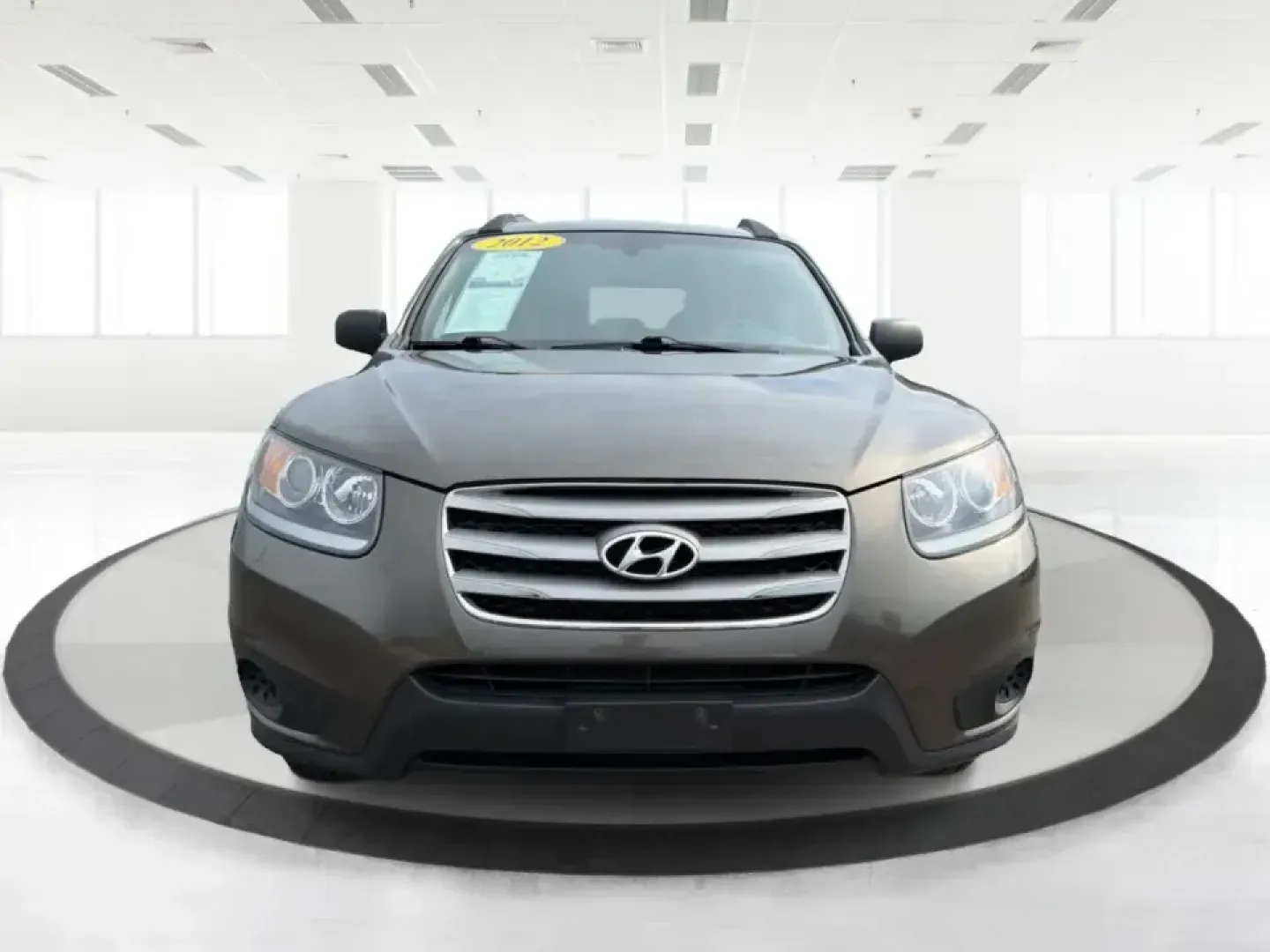 2012 Hyundai Santa Fe GLS 2.4 FWD (5XYZG3AB8CG) with an 2.4L L4 DOHC 16V engine, 6-Speed Automatic transmission, located at 8750 N County Rd 25A, Piqua, OH, 45356, (937) 908-9800, 40.164391, -84.232513 - Picture an easy weekend getaway: you load the cooler, fold the second-row seats for extra gear, and head out of Piqua toward Indian Lake or a day trip through the Miami Valley-without needing a giant SUV. This 2012 Hyundai Santa Fe GLS 2.4 is a practical, five-passenger SUV that fits real life, whet- Photo#7