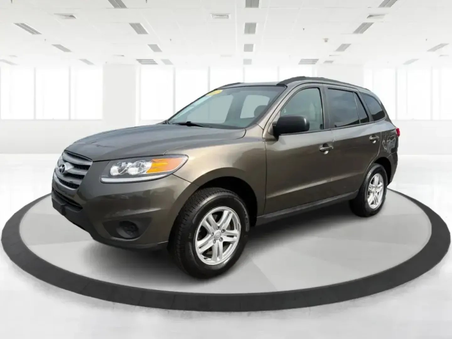 2012 Hyundai Santa Fe GLS 2.4 FWD (5XYZG3AB8CG) with an 2.4L L4 DOHC 16V engine, 6-Speed Automatic transmission, located at 8750 N County Rd 25A, Piqua, OH, 45356, (937) 908-9800, 40.164391, -84.232513 - Picture an easy weekend getaway: you load the cooler, fold the second-row seats for extra gear, and head out of Piqua toward Indian Lake or a day trip through the Miami Valley-without needing a giant SUV. This 2012 Hyundai Santa Fe GLS 2.4 is a practical, five-passenger SUV that fits real life, whet- Photo#8