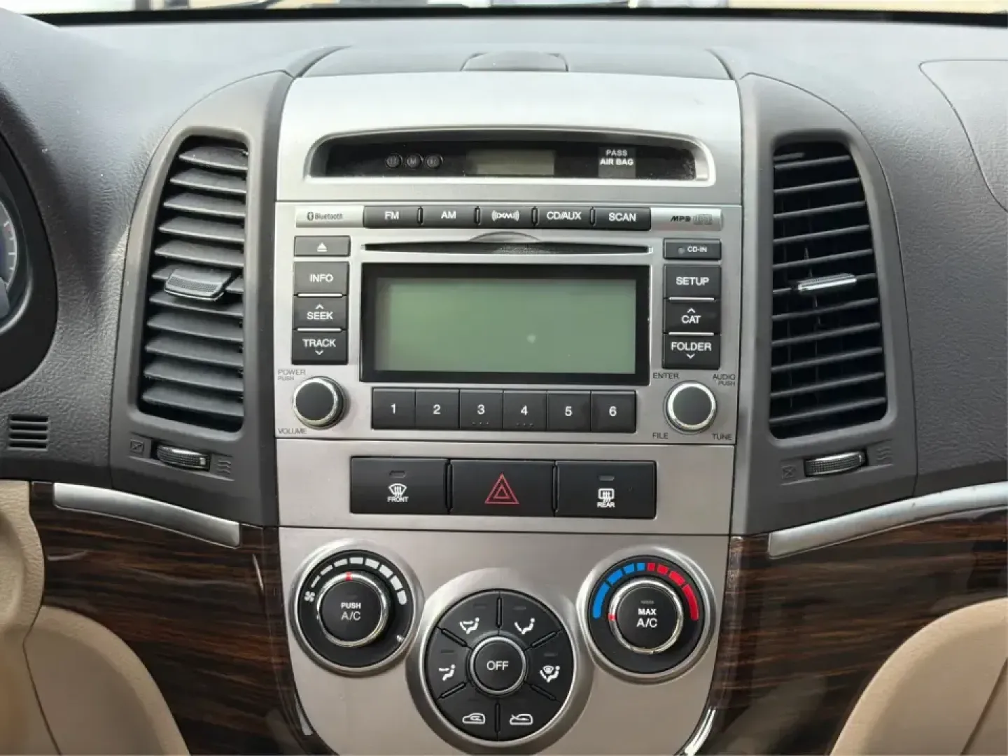 2012 Hyundai Santa Fe GLS 2.4 FWD (5XYZG3AB8CG) with an 2.4L L4 DOHC 16V engine, 6-Speed Automatic transmission, located at 8750 N County Rd 25A, Piqua, OH, 45356, (937) 908-9800, 40.164391, -84.232513 - Picture an easy weekend getaway: you load the cooler, fold the second-row seats for extra gear, and head out of Piqua toward Indian Lake or a day trip through the Miami Valley-without needing a giant SUV. This 2012 Hyundai Santa Fe GLS 2.4 is a practical, five-passenger SUV that fits real life, whet- Photo#13