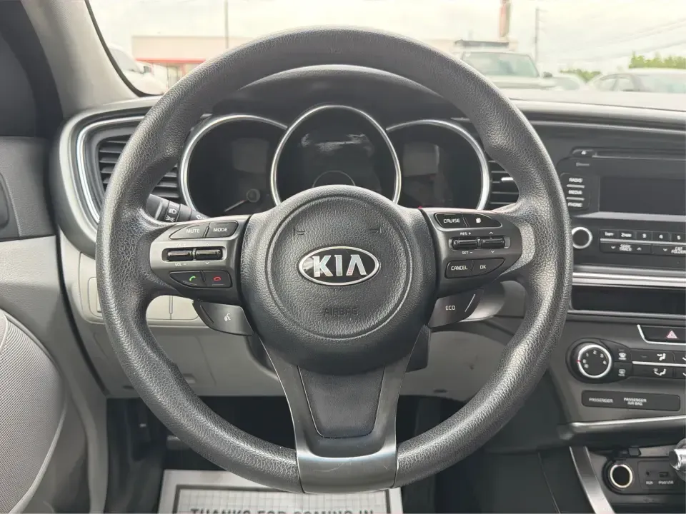 2014 Kia Optima 2.4 LX STD/Conv (5XXGM4A77EG) with an Theta II 2.4L I-4 gasoline direct injection engine, located at 8750 N County Rd 25A, Piqua, OH, 45356, (937) 908-9800, 40.164391, -84.232513 - Picture your next week: a smooth, fuel-sipping commute down I-75, a quick run to Miami Valley Centre Mall, and a comfortable evening drive through downtown Piqua-without giving up style or practicality. This 2014 Kia Optima 2.4 LX (STD/Conv) in Satin Metal is a smart sedan for real life: roomy enoug- Photo#16