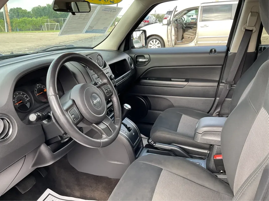 2014 Jeep Patriot Latitude (1C4NJPFA4ED) with an Other engine, located at 1099 N County Rd 25A, Troy, OH, 45373, (937) 908-9800, 40.057079, -84.212883 - **Adventure Awaits with This 2014 Jeep Patriot Latitude at Advantage Car and Credit - Moraine!**<br /> <br /> Are you ready to embark on new adventures, whether it's a weekend getaway, a family road trip, or daily commutes? This 2014 Jeep Patriot Latitude is your perfect companion for all these scen - Photo#9